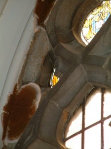 Growth of dry rot on arch head of South Window 2nd from West 7sept09